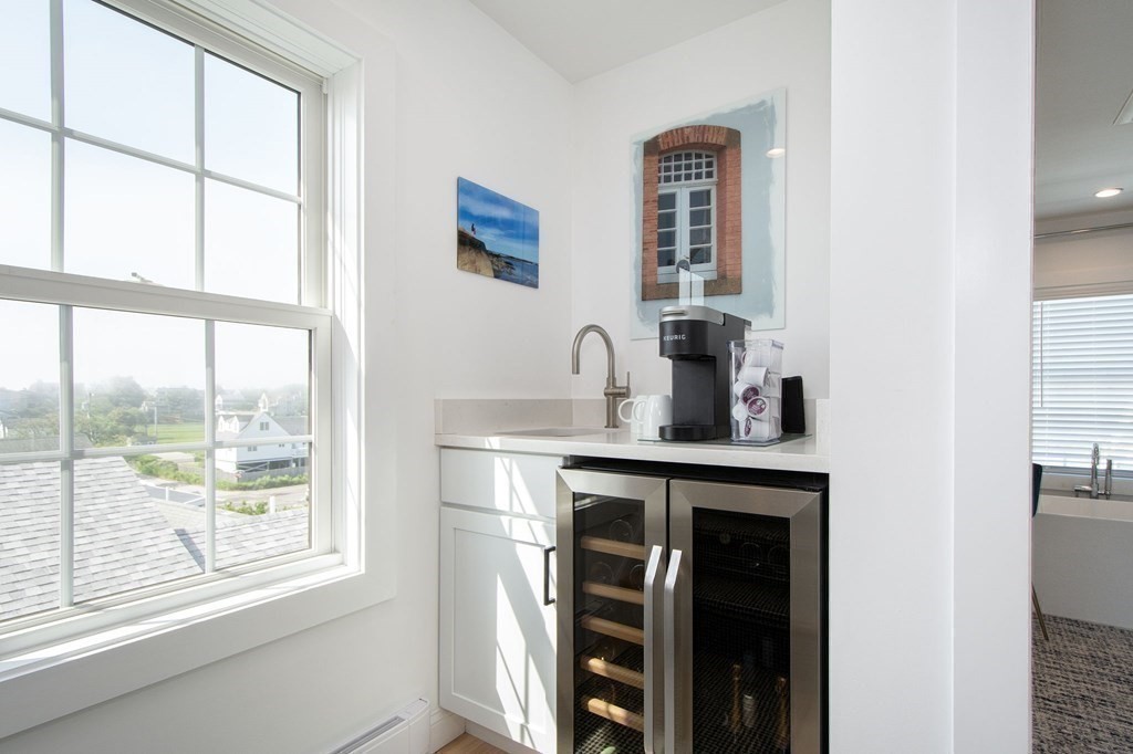 83 Glades Road Scituate, MA 02066 - Photo 22 of 37 a kitchen with a sink and a large window