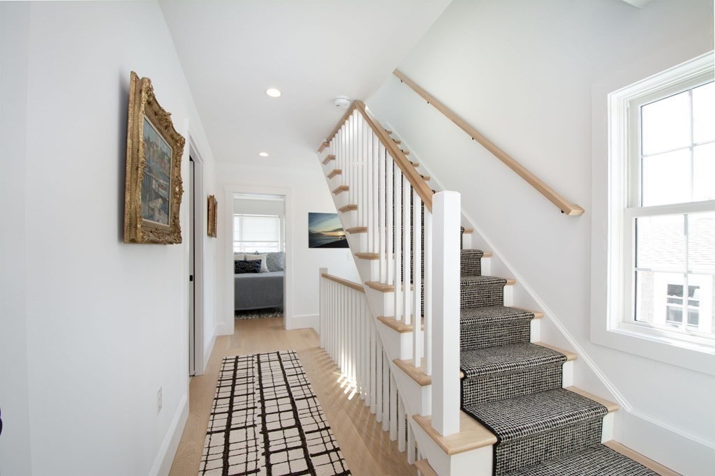 83 Glades Road Scituate, MA 02066 - Photo 23 of 37 a view of entryway and hall with wooden floor