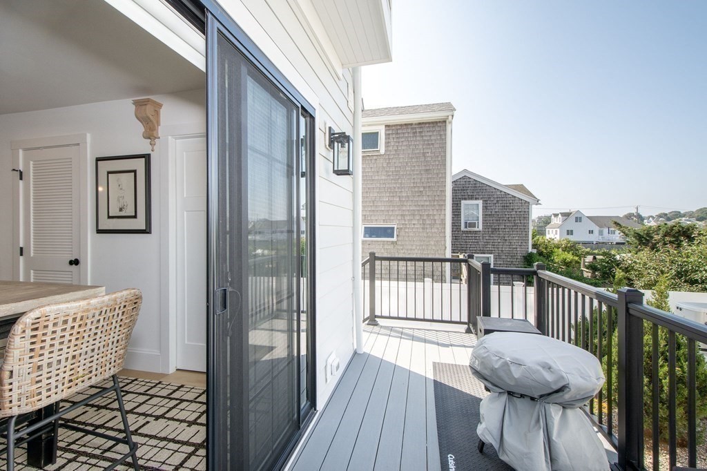 83 Glades Road Scituate, MA 02066 - Photo 26 of 37 a view of a deck with furniture and wooden floor