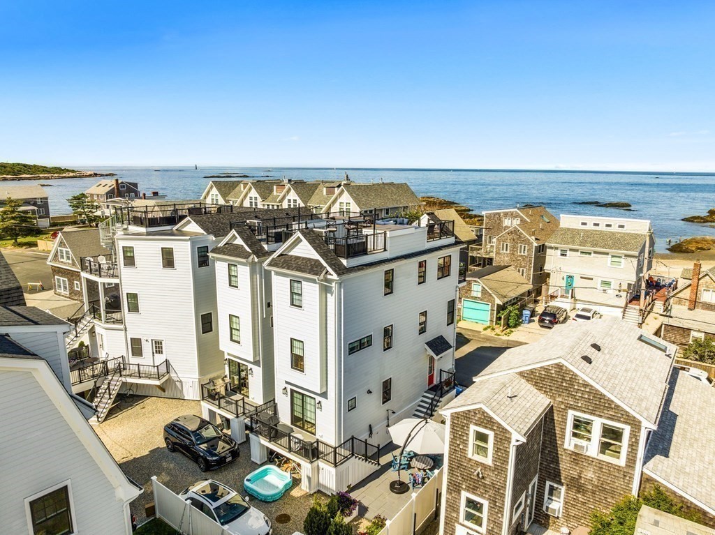 83 Glades Road Scituate, MA 02066 - Photo 29 of 37 a view of living room with furniture and a floor to ceiling window