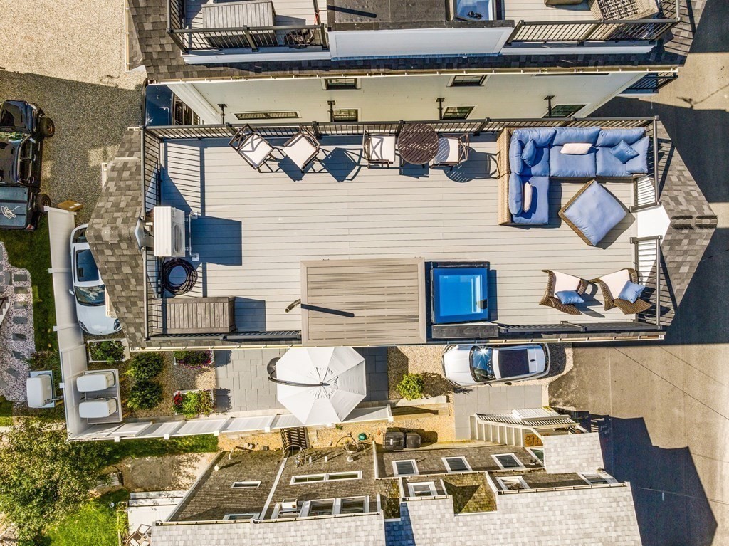 83 Glades Road Scituate, MA 02066 - Photo 4 of 37 a view of a patio with table and chairs