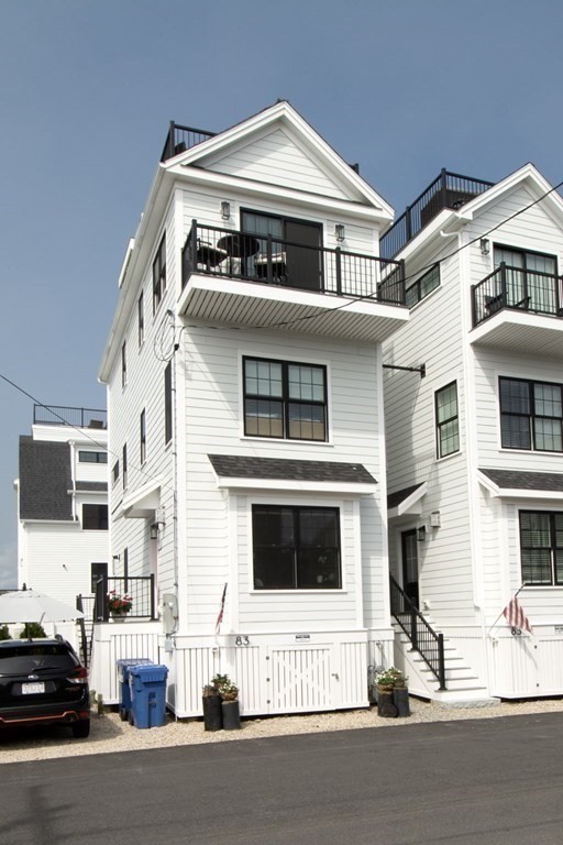 83 Glades Road Scituate, MA 02066 - Photo 5 of 37 a front view of a house with a street