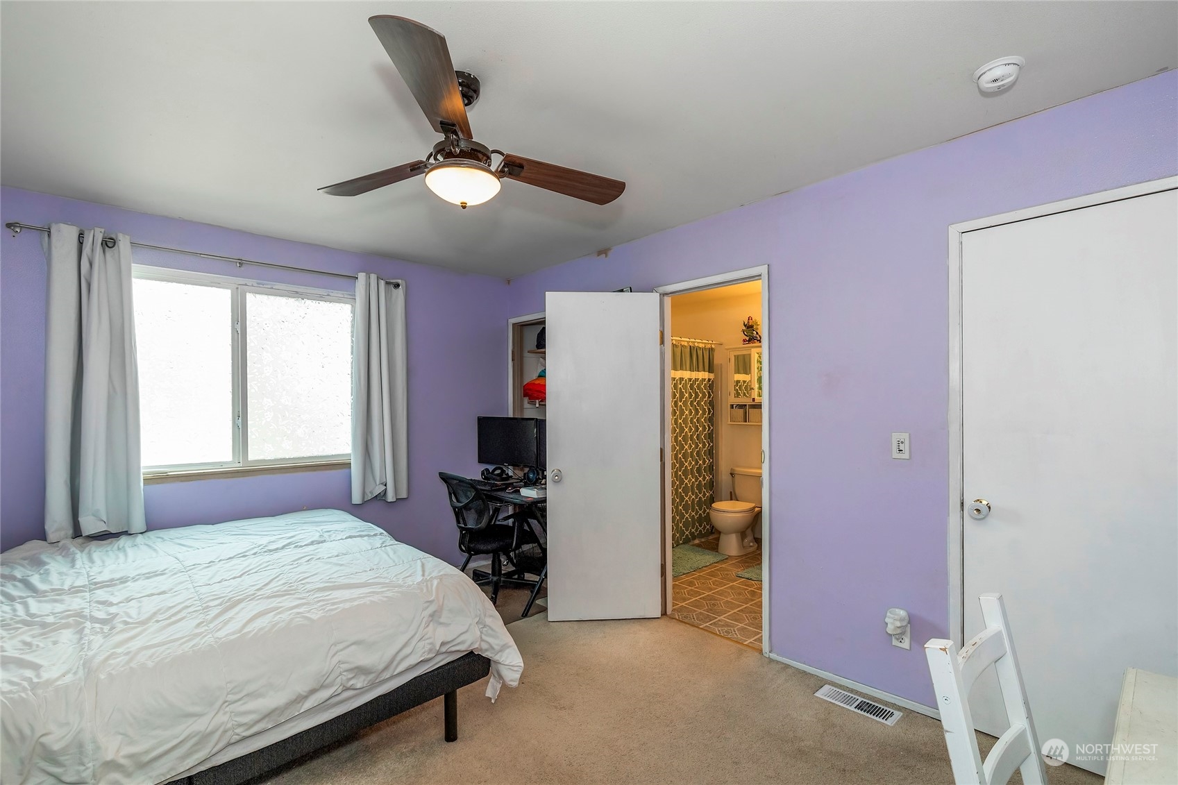 3992 Broadmoor Loop Bremerton, WA 98310 - Photo 16 of 34 a bedroom with a bed and a chandelier