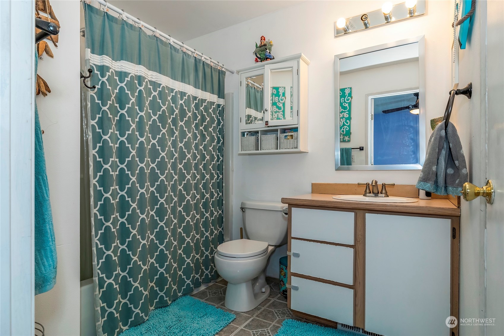 3992 Broadmoor Loop Bremerton, WA 98310 - Photo 17 of 34 a bathroom with a sink toilet and shower