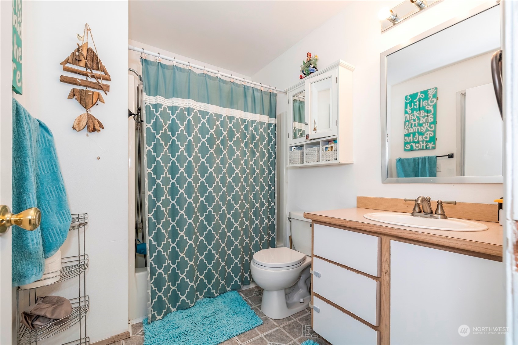 3992 Broadmoor Loop Bremerton, WA 98310 - Photo 18 of 34 a bathroom with a sink toilet and shower