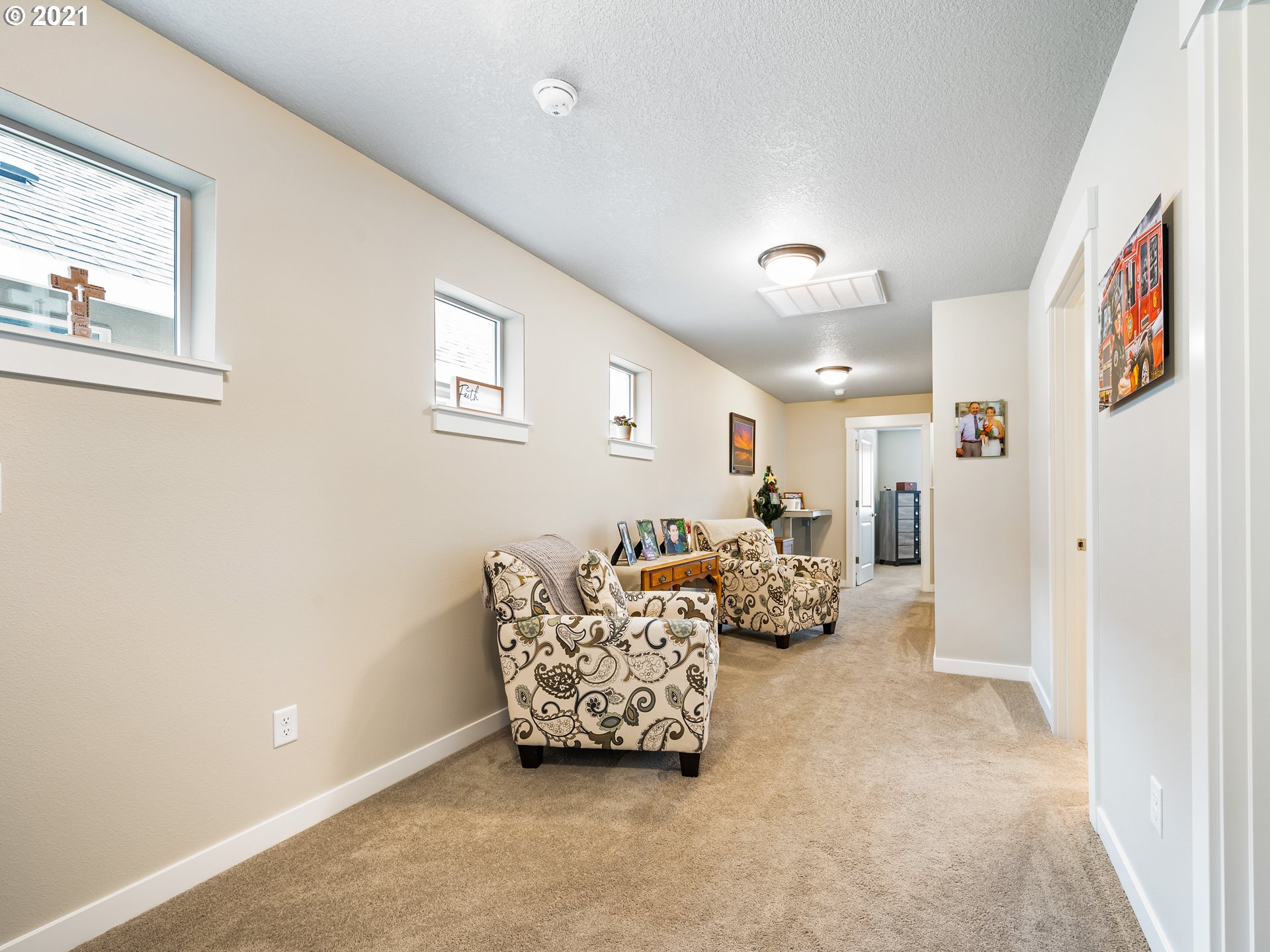 1133 South Union Place Ridgefield, WA 98642 - Photo 12 of 27 a living room with furniture and a chandelier
