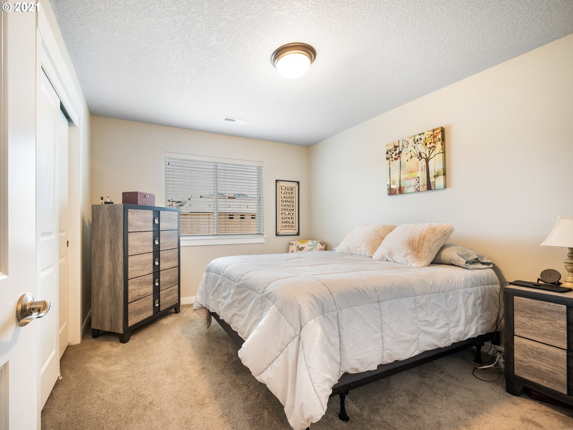 1133 South Union Place Ridgefield, WA 98642 - Photo 22 of 27 a bedroom with a bed and a cabinets