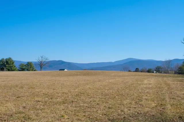 a view of an ocean beach and mountain