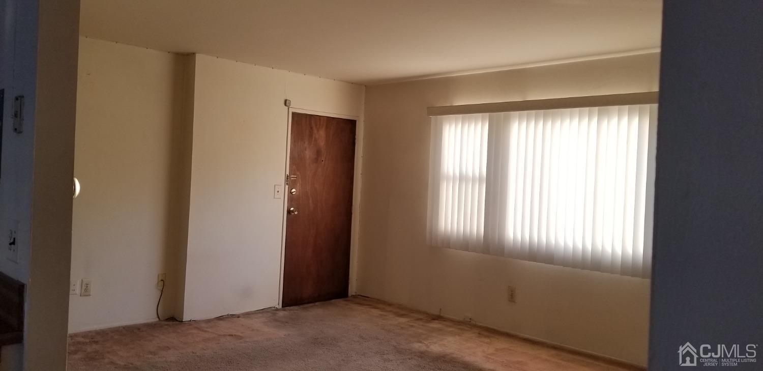 197 Evergreen Road, Unit 1A Edison, NJ 08837 - Photo 11 of 21 Living Room. Hardwood floors under carpet being refinished