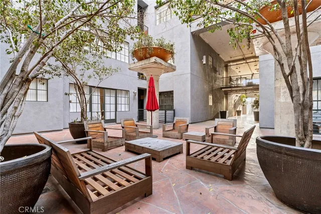 a outdoor space with patio couches and a potted plant