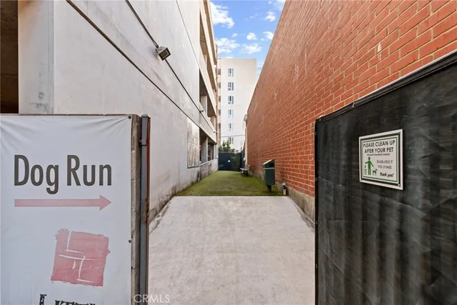 a view of a street sign on a brick wall