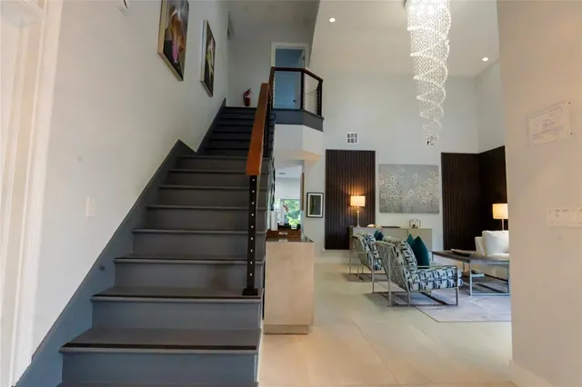 a kitchen with a dining table chairs and granite counter tops