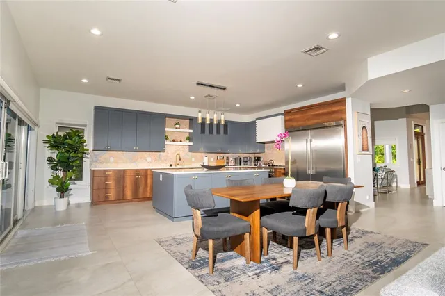 a view of a dining room with furniture window and outside view