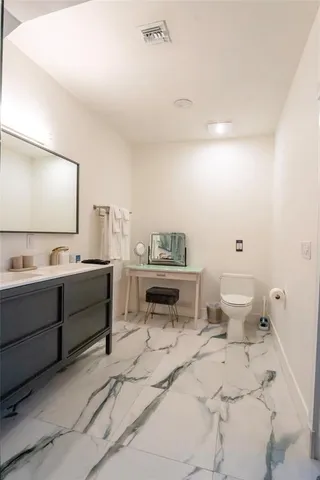 a view of a balcony with chairs