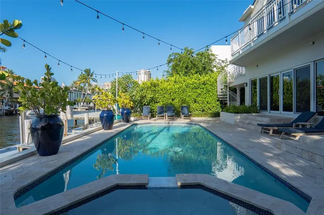 a view of a patio with dining table and chairs with a fire pit