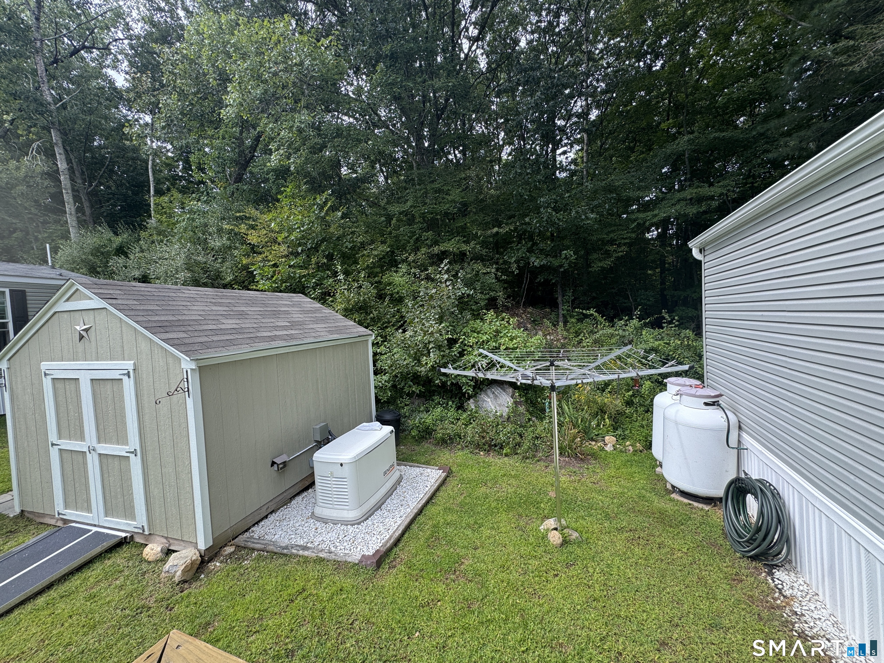 91 Chaffeeville Road Mansfield, CT 06250 - Photo 20 of 31 Big shed for outdoor storage. Riding lawn mower and tools come with.