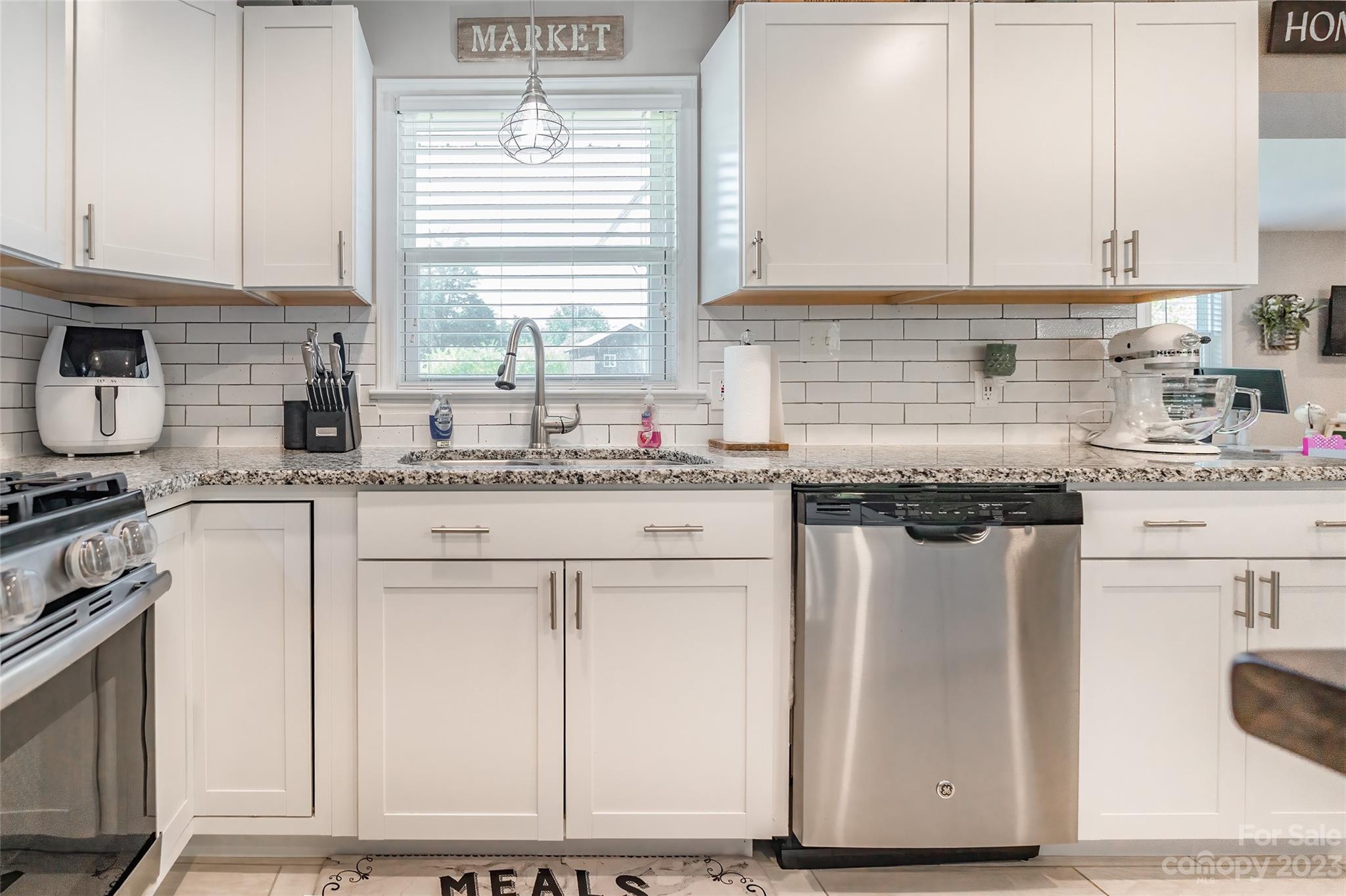 1514 Shiloh Unity Road Lancaster, SC 29720 - Photo 11 of 26 a kitchen with stainless steel appliances granite countertop a sink stove and cabinets
