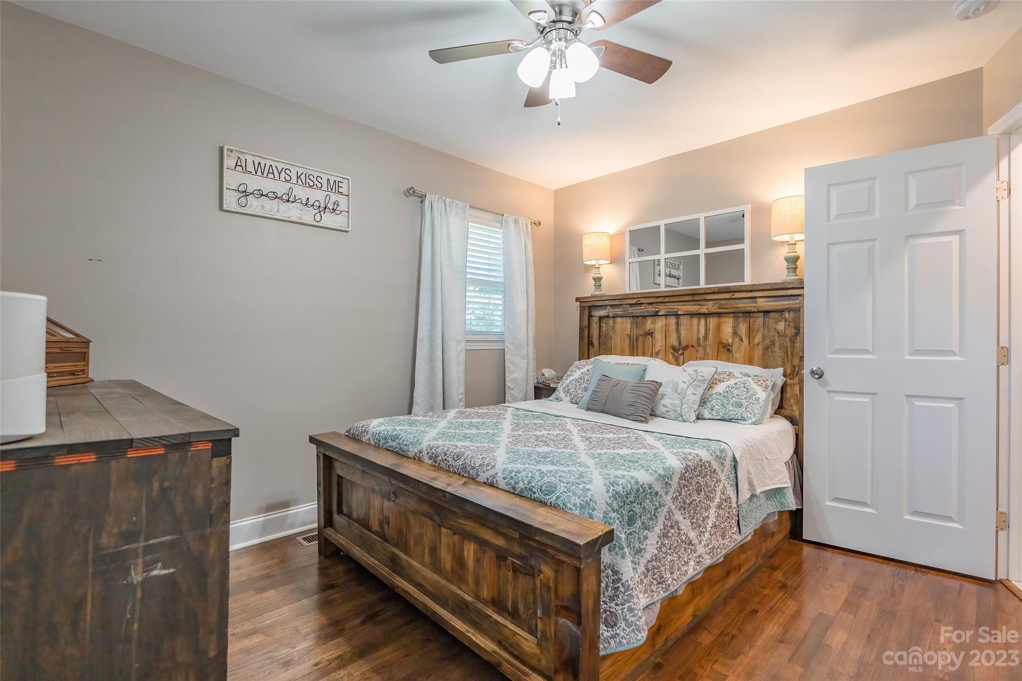 1514 Shiloh Unity Road Lancaster, SC 29720 - Photo 14 of 26 a bedroom with a bed and a chandelier