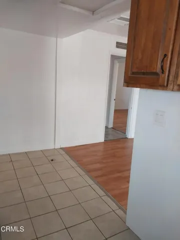 a kitchen with kitchen island a sink a stove and a refrigerator