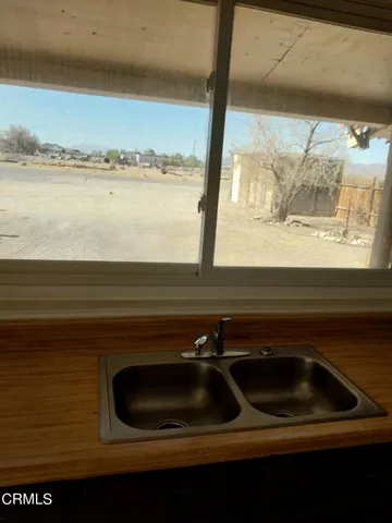 a bathroom with a toilet and a window