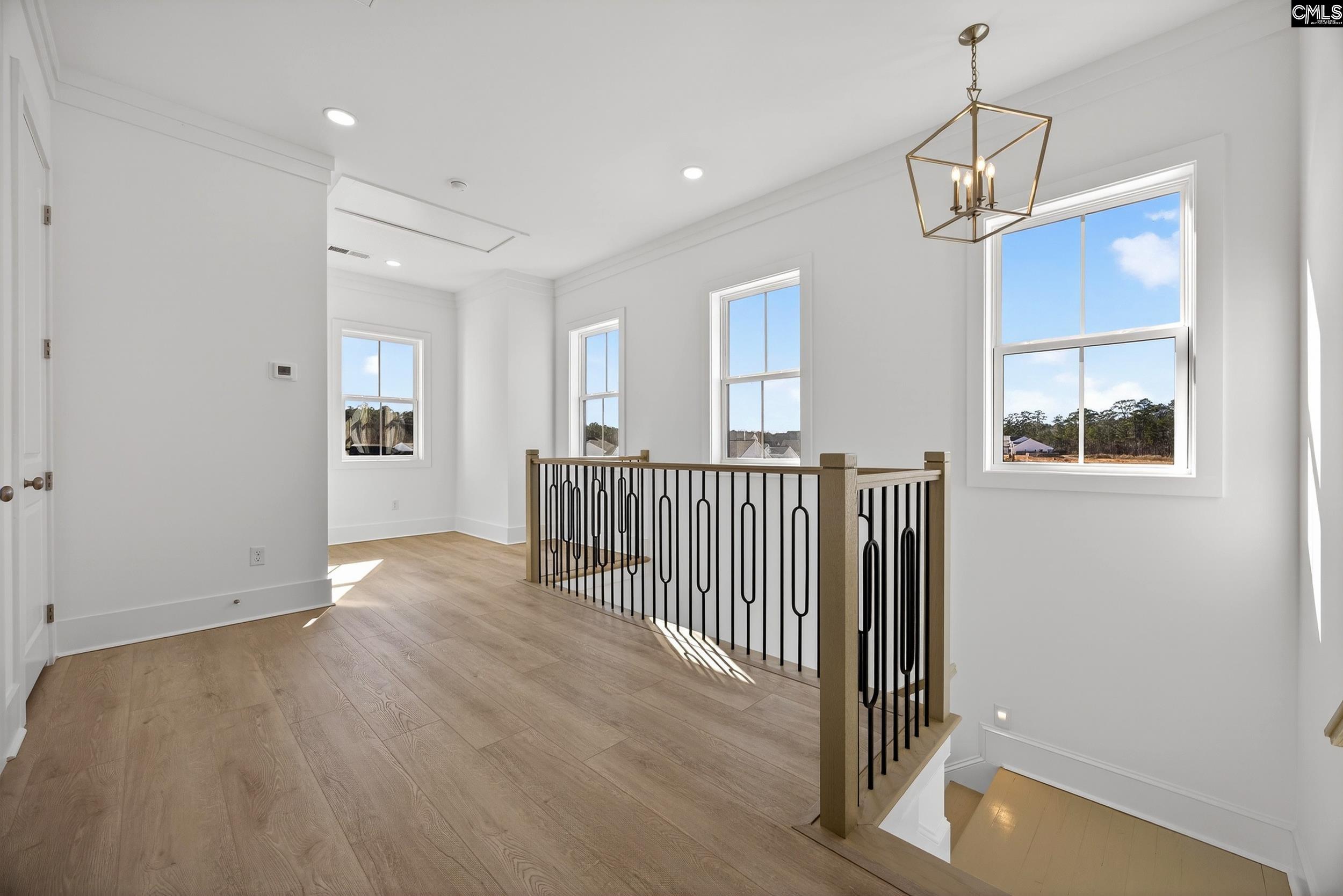 1318 Long Grove Way Lexington, SC 29072 - Photo 61 of 90 a view of a room with wooden floor and windows