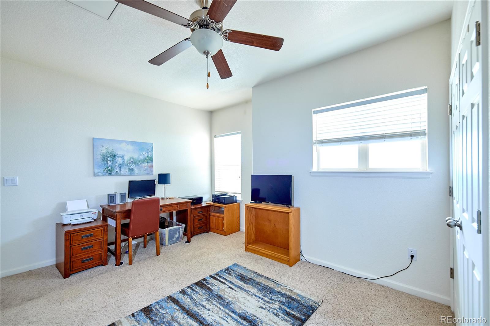 5800 Tower Road, Unit 610 Denver, CO 80249 - Photo 12 of 25 a living room with furniture and a window