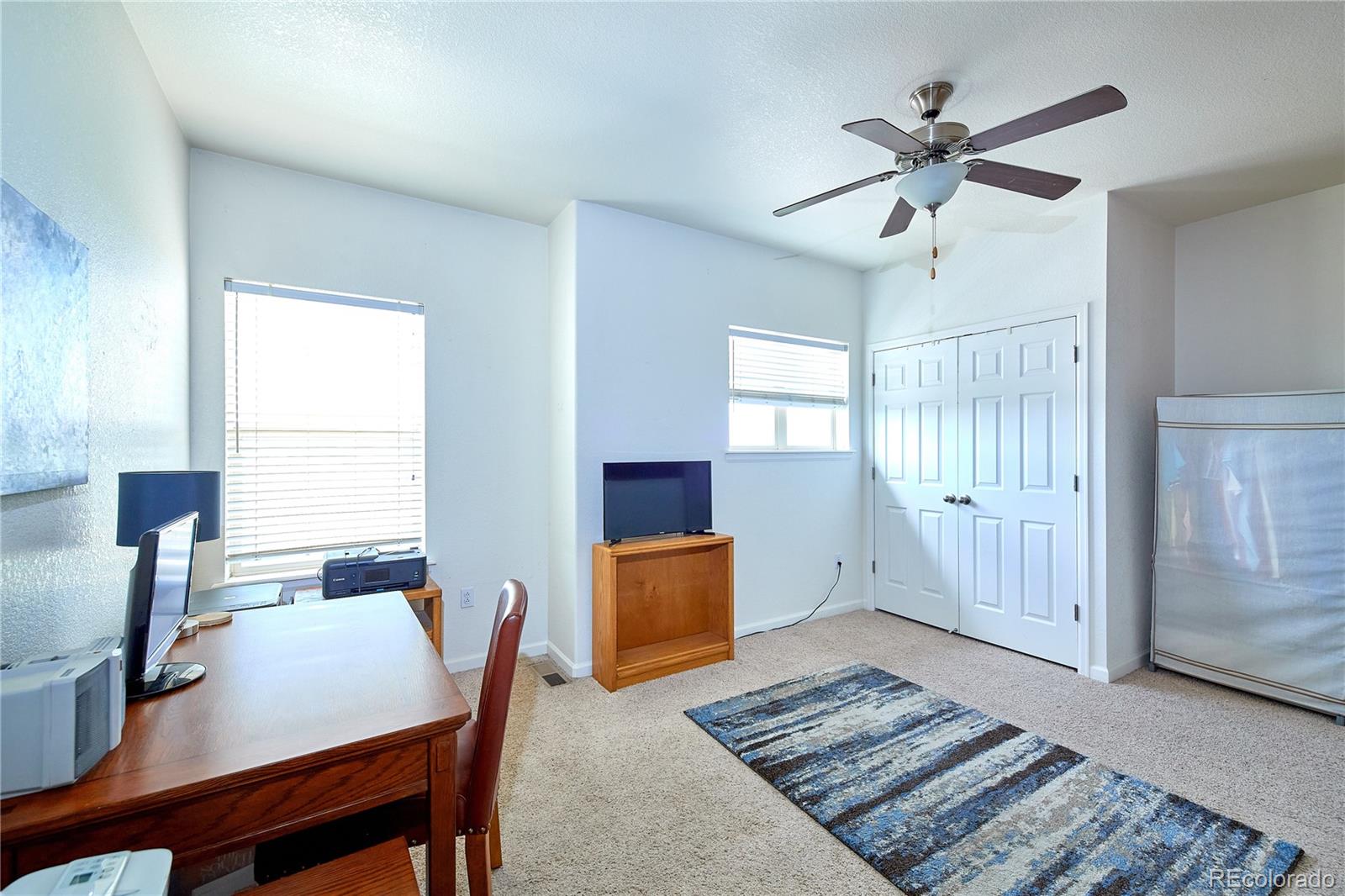 5800 Tower Road, Unit 610 Denver, CO 80249 - Photo 14 of 25 a living room with furniture and a window