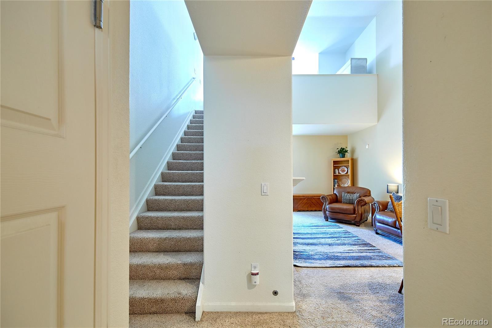 5800 Tower Road, Unit 610 Denver, CO 80249 - Photo 17 of 25 a view of entryway and hall with wooden floor