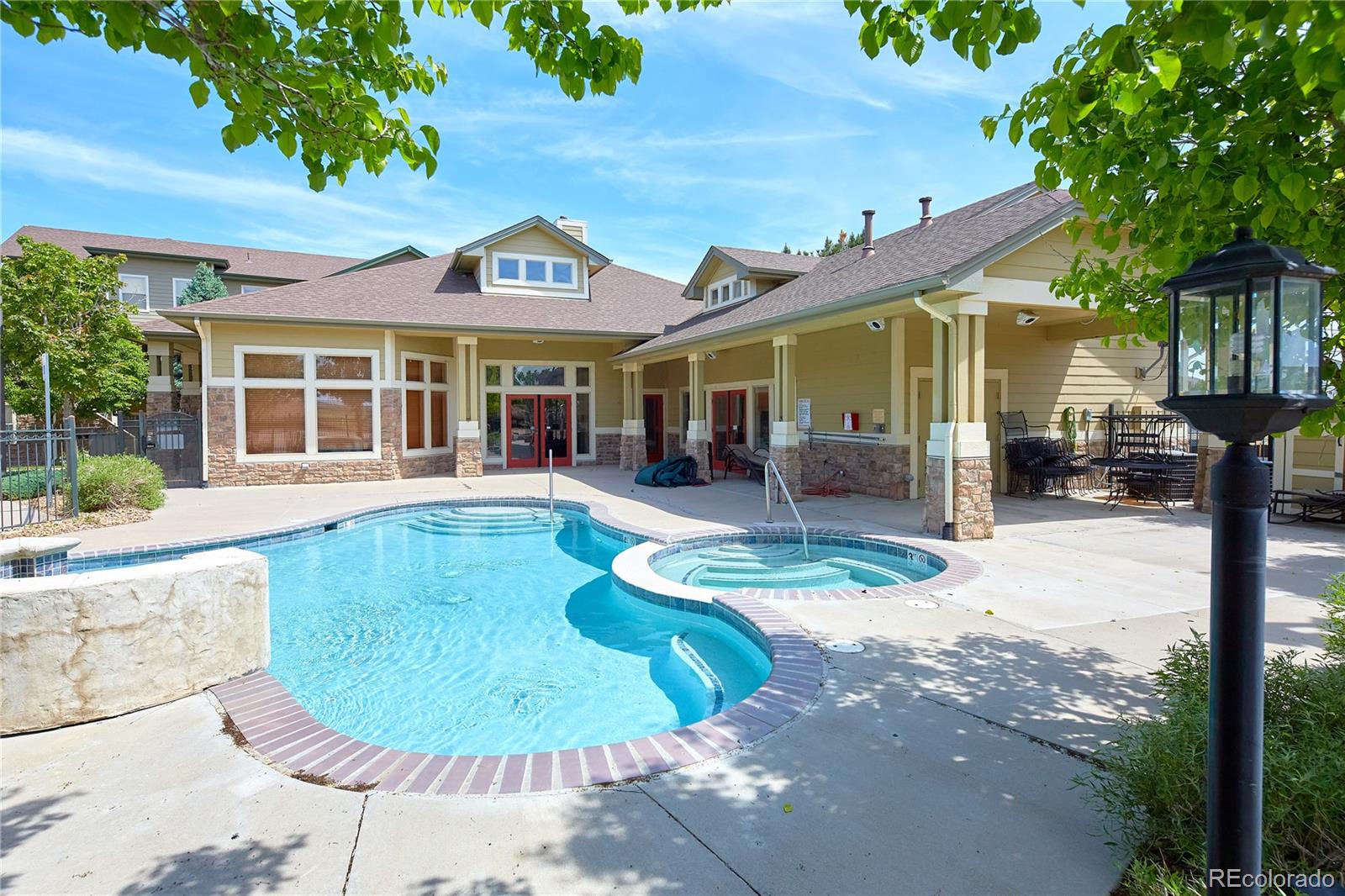 5800 Tower Road, Unit 610 Denver, CO 80249 - Photo 24 of 25 front view of a house with a swimming pool