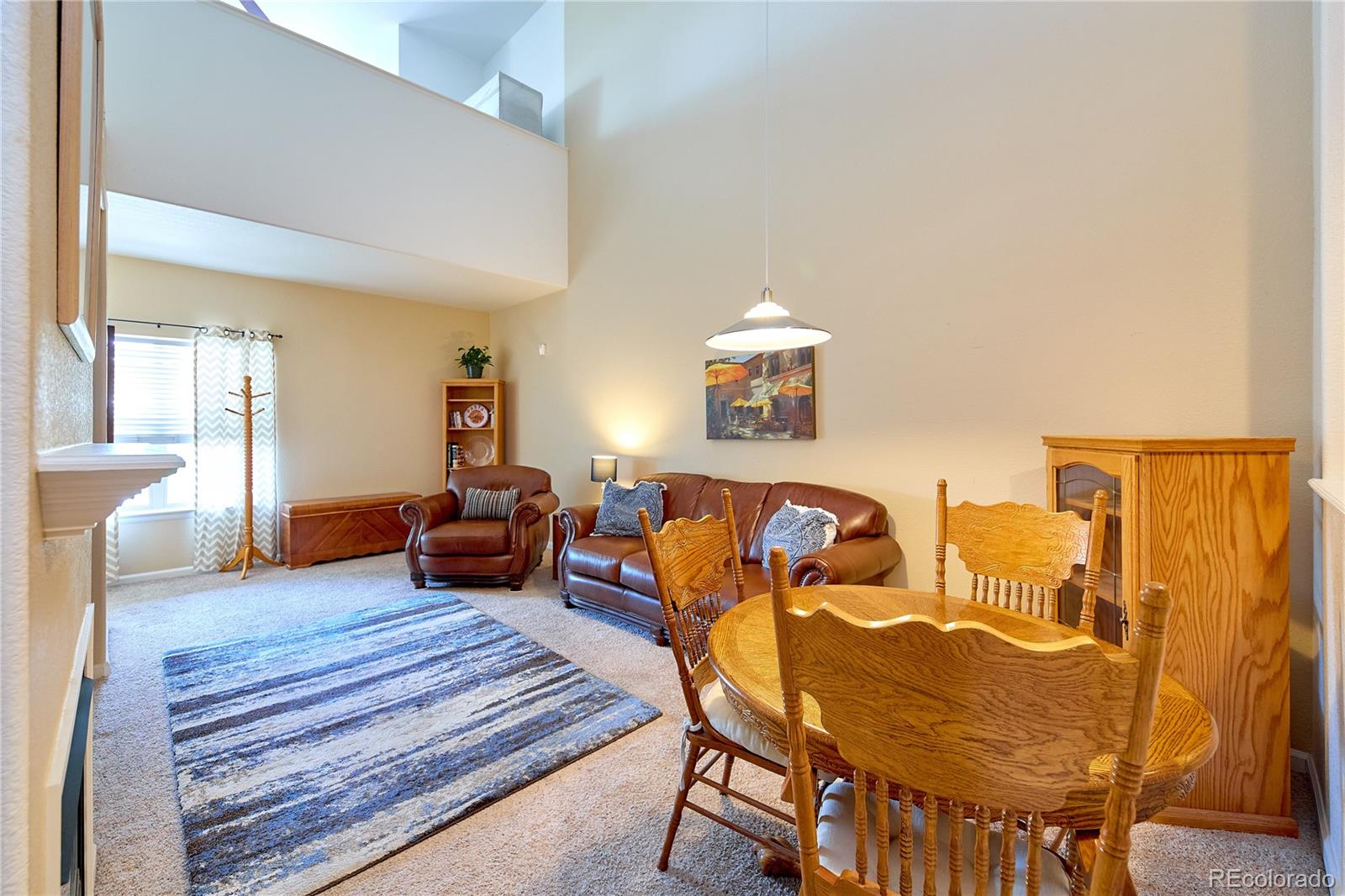 5800 Tower Road, Unit 610 Denver, CO 80249 - Photo 6 of 25 a living room with furniture and wooden floor