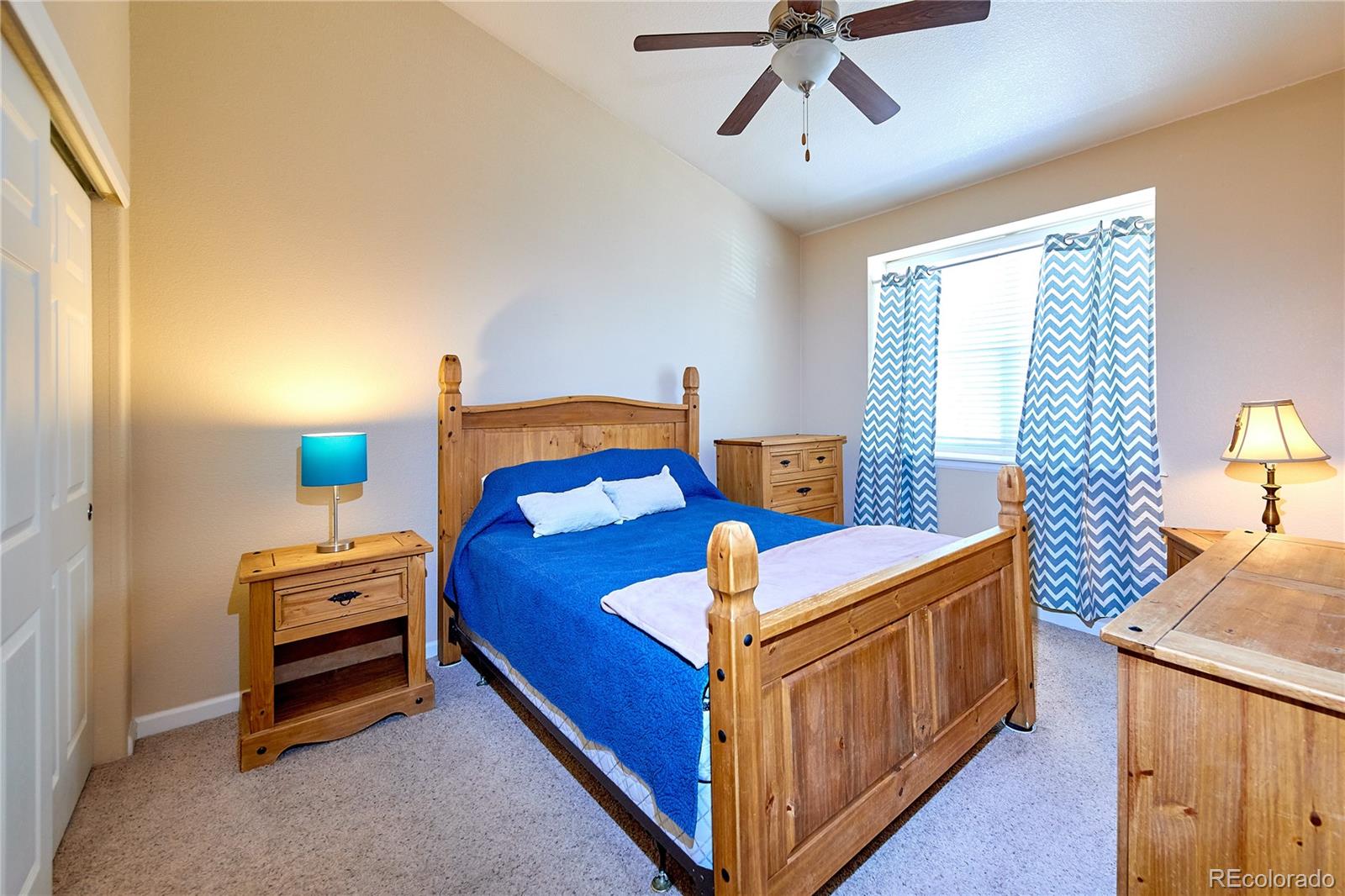 5800 Tower Road, Unit 610 Denver, CO 80249 - Photo 10 of 25 a bedroom with a bed and a dresser