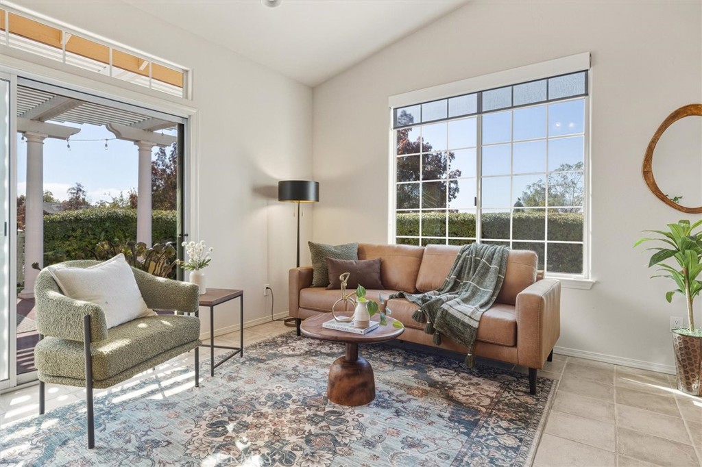 1608 Via Flora Paso Robles, CA 93446 - Photo 11 of 57 a living room with furniture a window and a table