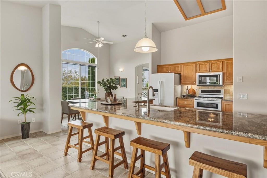 1608 Via Flora Paso Robles, CA 93446 - Photo 15 of 57 a kitchen with a table and chairs in it