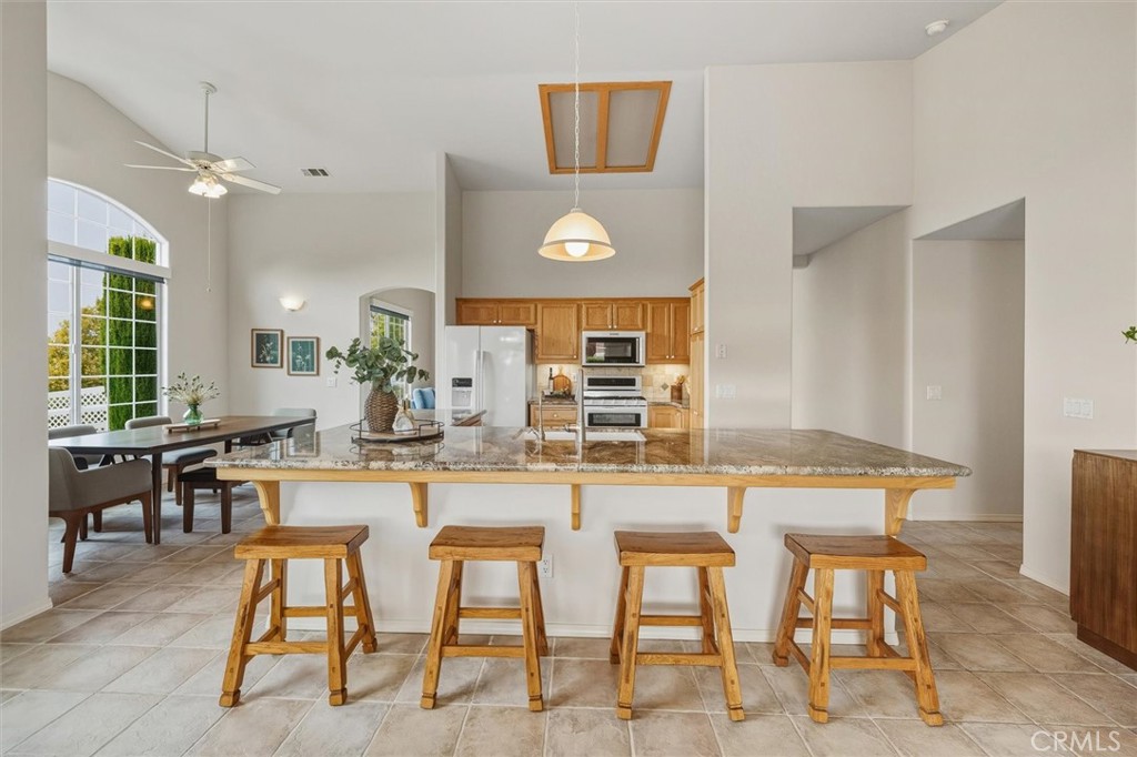 1608 Via Flora Paso Robles, CA 93446 - Photo 16 of 57 a kitchen with a table and chairs in it