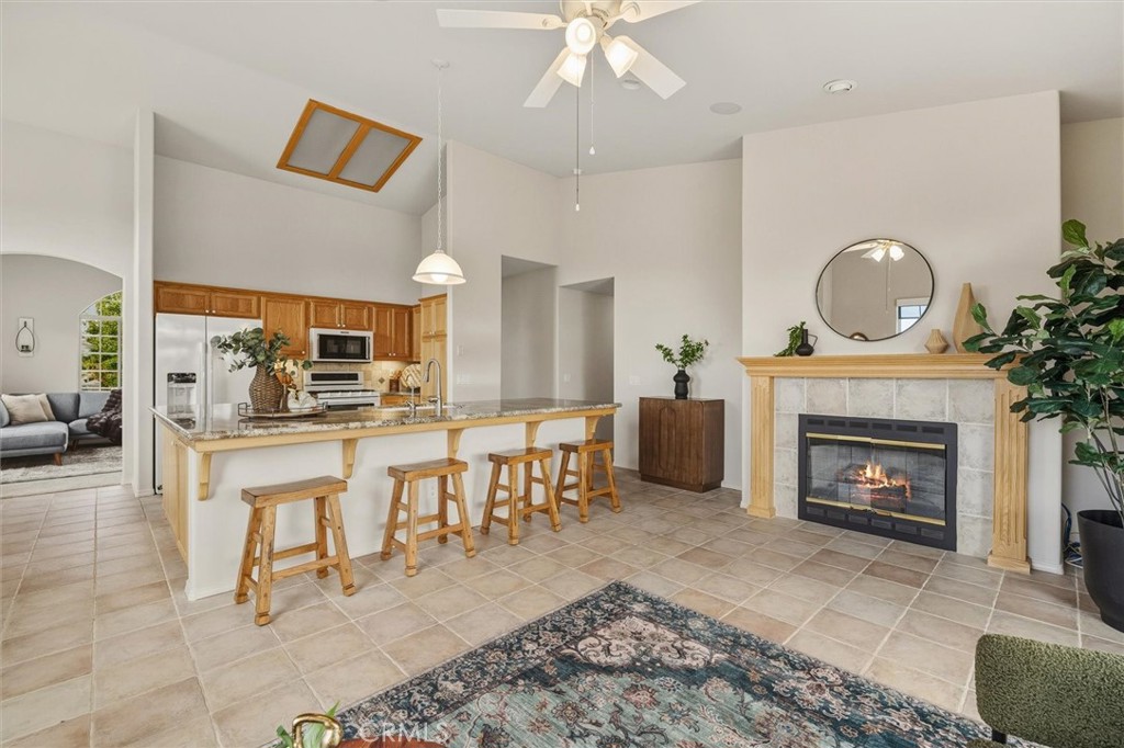 1608 Via Flora Paso Robles, CA 93446 - Photo 17 of 57 a living room with furniture a fireplace and a table