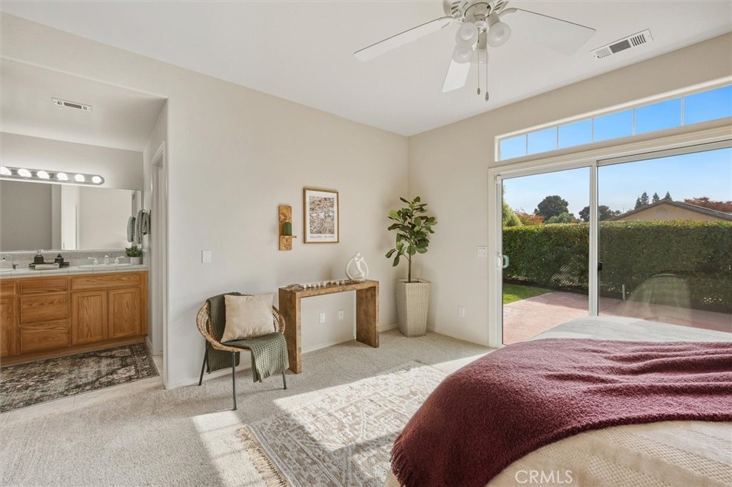 1608 Via Flora Paso Robles, CA 93446 - Photo 22 of 57 a bedroom with a bed and a window