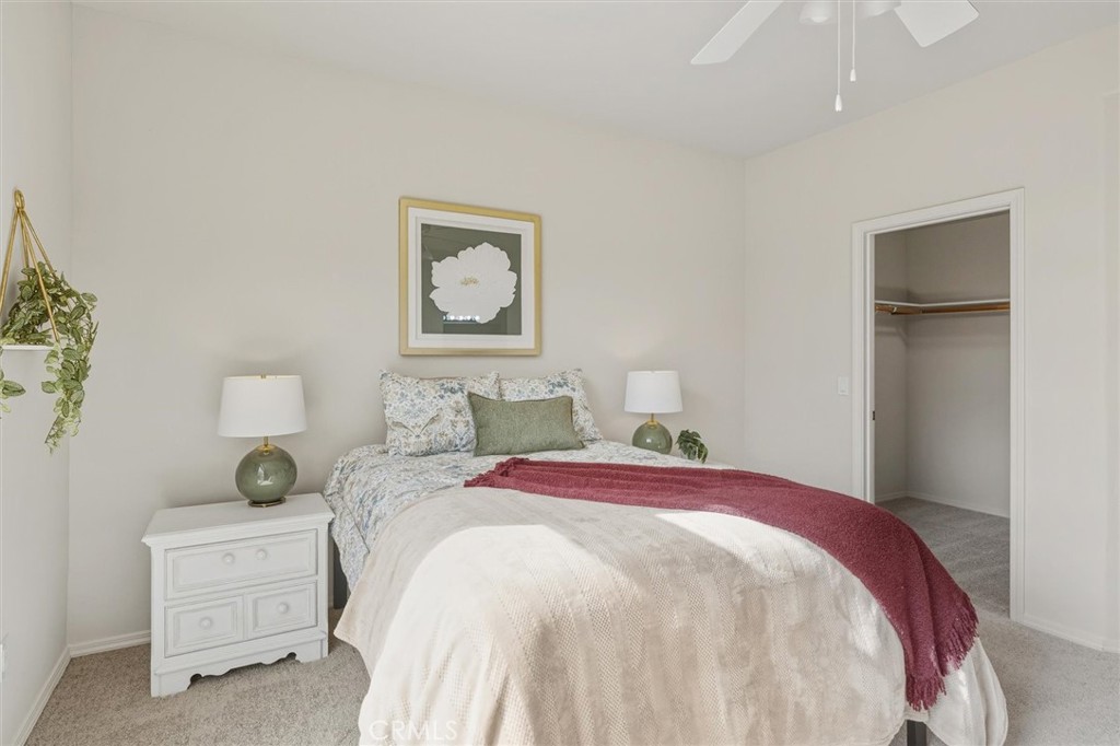 1608 Via Flora Paso Robles, CA 93446 - Photo 23 of 57 a bedroom with a bed and a painting on the wall