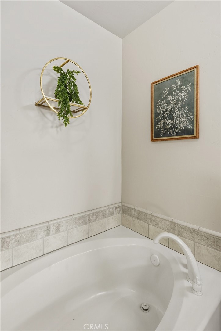 1608 Via Flora Paso Robles, CA 93446 - Photo 26 of 57 a bathroom with a bathtub