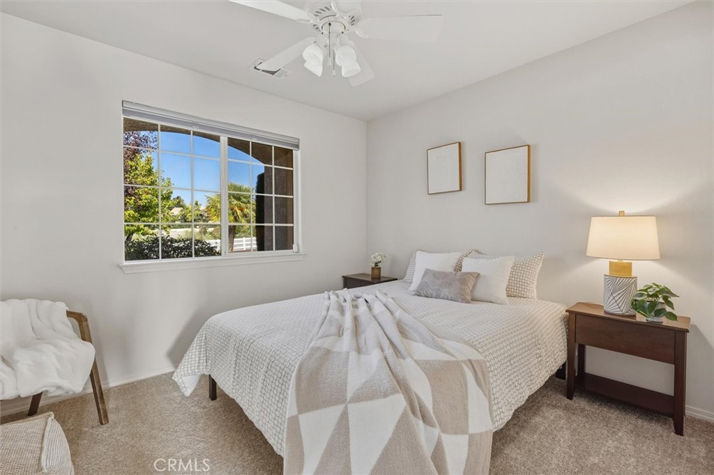 1608 Via Flora Paso Robles, CA 93446 - Photo 31 of 57 a bedroom with a bed and a window
