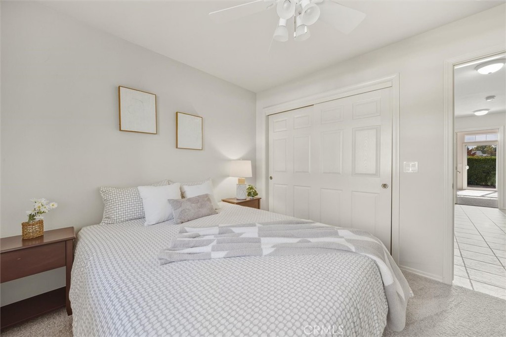 1608 Via Flora Paso Robles, CA 93446 - Photo 32 of 57 a bedroom with a bed and a chandelier