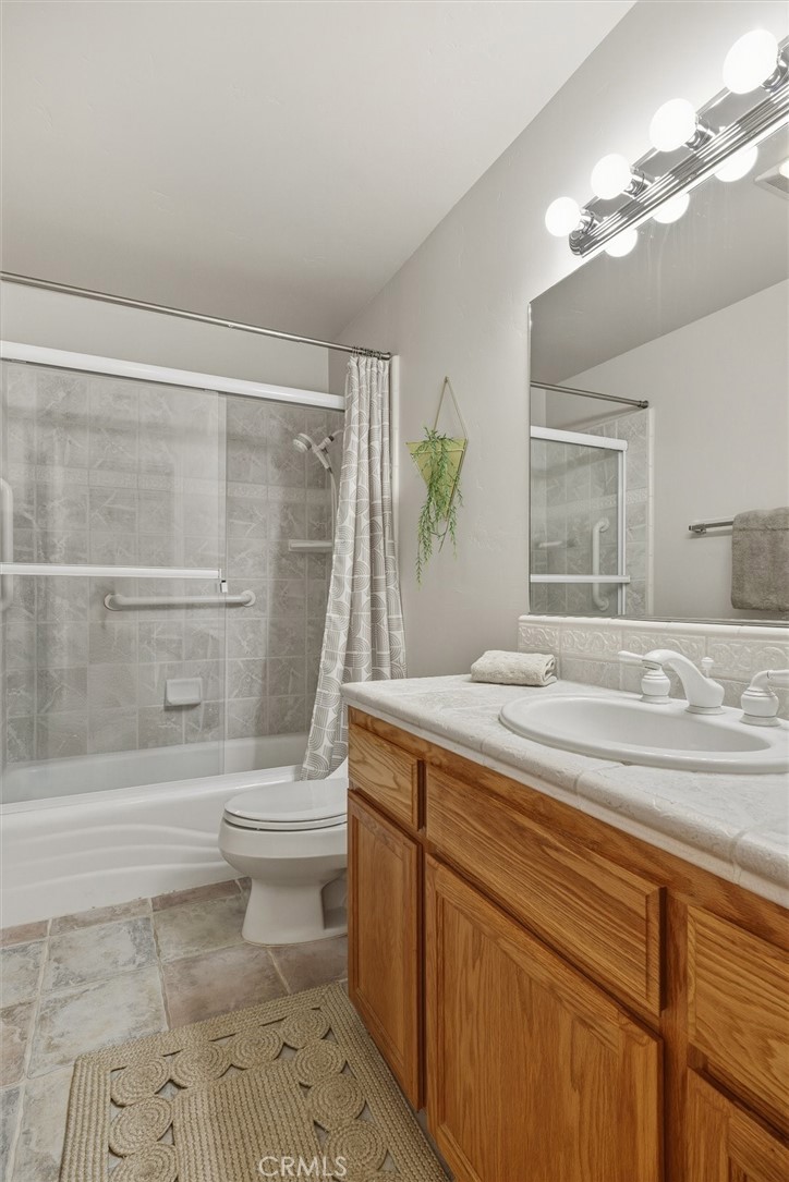 1608 Via Flora Paso Robles, CA 93446 - Photo 34 of 57 a bathroom with a sink a toilet and shower