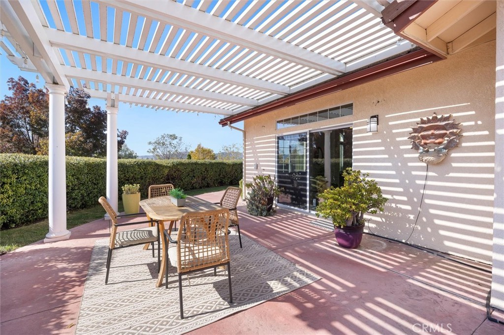 1608 Via Flora Paso Robles, CA 93446 - Photo 39 of 57 a view of a patio with a table and chairs and potted plants