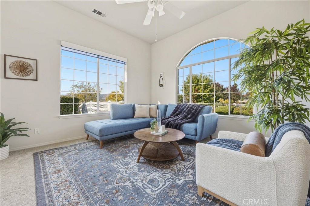 1608 Via Flora Paso Robles, CA 93446 - Photo 8 of 57 a living room with furniture and a large window