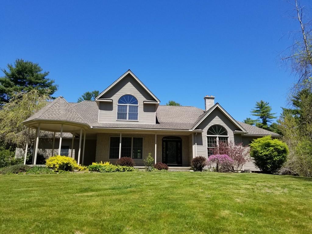 75 Cummings Road Ware, MA 01082 - Photo 1 of 37 a front view of a house with a garden