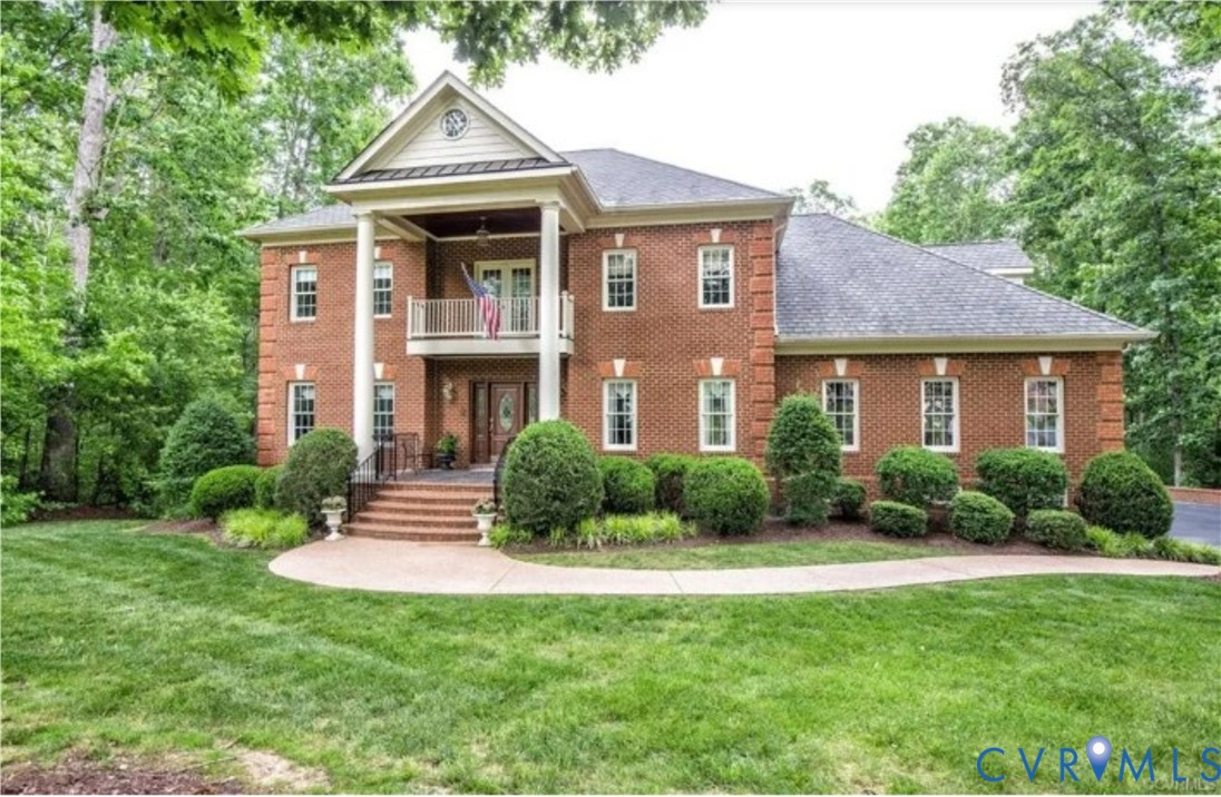 1638 Fallen Timber Trail Powhatan, VA 23139 - Photo 2 of 46 a front view of a house with a yard and green space