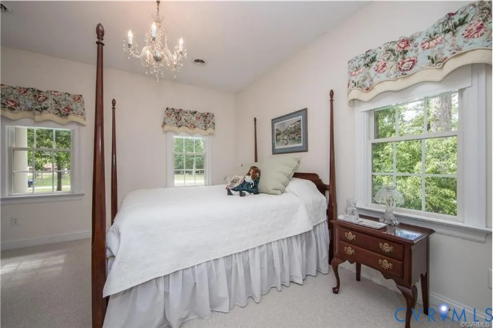 1638 Fallen Timber Trail Powhatan, VA 23139 - Photo 26 of 46 a bed sitting in a bedroom next to a window