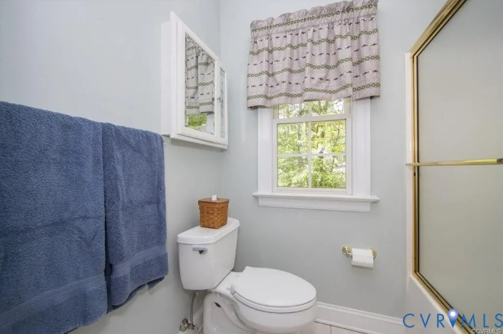 1638 Fallen Timber Trail Powhatan, VA 23139 - Photo 28 of 46 a bathroom with a toilet a sink and a window