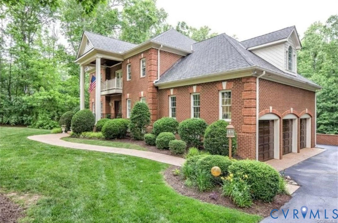 1638 Fallen Timber Trail Powhatan, VA 23139 - Photo 3 of 46 a front view of a house with a yard