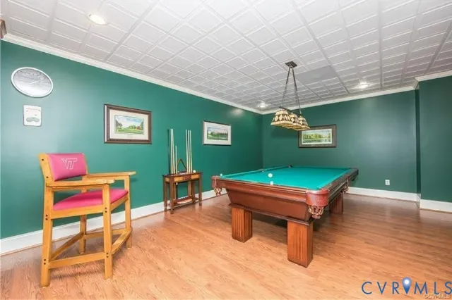 a room with furniture and pool table
