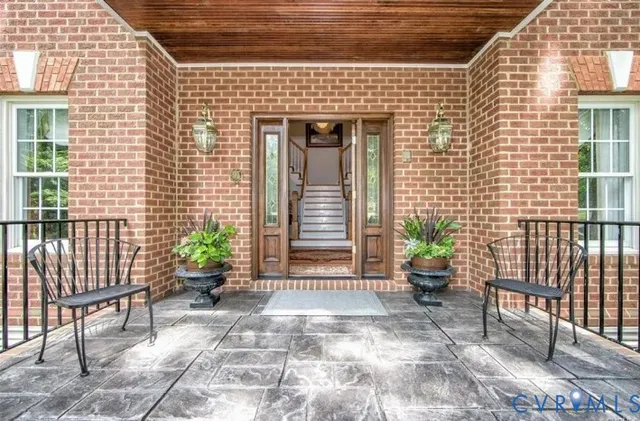 a front view of a house with chairs